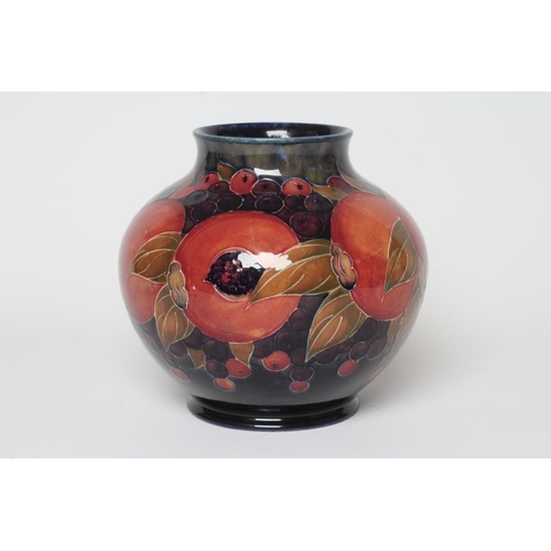 71 - A MOORCROFT POTTERY POMEGRANATE VASE, c.1916, of squat baluster form, signed in green, impressed Bur... 