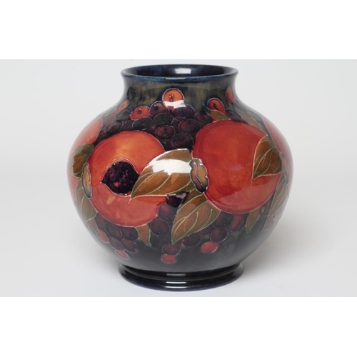 71 - A MOORCROFT POTTERY POMEGRANATE VASE, c.1916, of squat baluster form, signed in green, impressed Bur... 