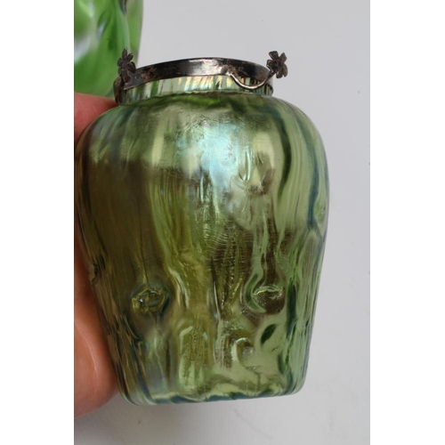 74 - A TIFFANY STYLE IRIDESCENT GREEN GLASS VASE of flared cylindrical form with bark type moulding, the ... 