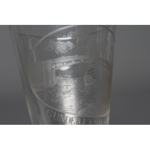 75 - A SUNDERLAND BRIDGE CLEAR GLASS GOBLET, the bucket bowl wheel engraved with a titled oval panel, iss... 