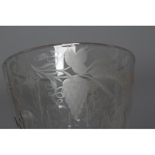 77 - A WILLIAM IV LARGE GLASS GOBLET, the panelled bucket bowl etched HG within a border engraved with ho... 