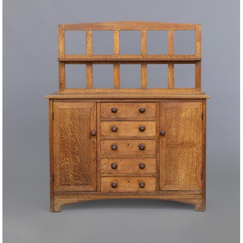 659 - A SMALL HEALS STYLE ARTS AND CRAFTS SIDEBOARD, late 19th century, the mildly arched open panelled ba... 