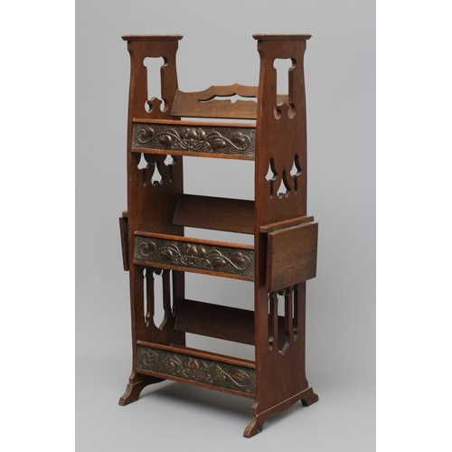 660 - AN ARTS AND CRAFTS OAK BOOKSTAND, c.1900, of oblong three tier form, the pierced and shaped sides wi... 