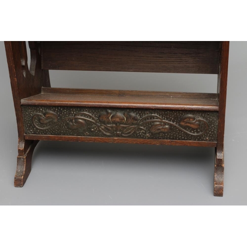 660 - AN ARTS AND CRAFTS OAK BOOKSTAND, c.1900, of oblong three tier form, the pierced and shaped sides wi... 