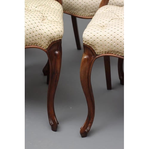 662 - A SET OF SIX VICTORIAN ROSEWOOD DINING CHAIRS button upholstered in a cream and green weave, the wai... 