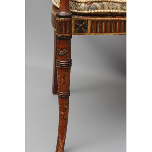 663 - AN EDWARDIAN CANED AND FLORAL PAINTED ELBOW CHAIR, early 20th century, the straight top rail over ov... 