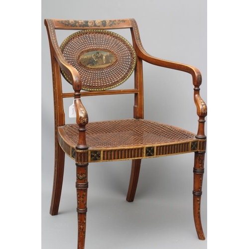 663 - AN EDWARDIAN CANED AND FLORAL PAINTED ELBOW CHAIR, early 20th century, the straight top rail over ov... 