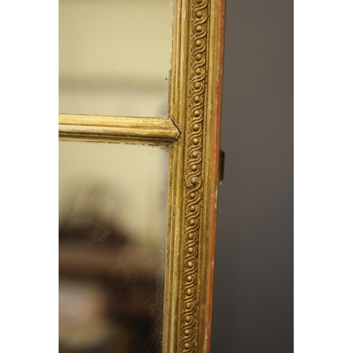 664 - AN EDWARDIAN TRIPLE PLATE GILDED WALL MIRROR, the oblong plates within a chain link moulded gilt ges... 