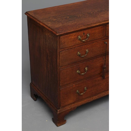 670 - A GEORGIAN OAK STRAIGHT FRONT CHEST, early 19th century, the moulded edged top over two short and th... 