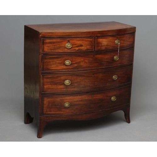 671 - A REGENCY MAHOGANY BOWED CHEST, early 19th century, with ebony stringing, the caddy top over two sho... 