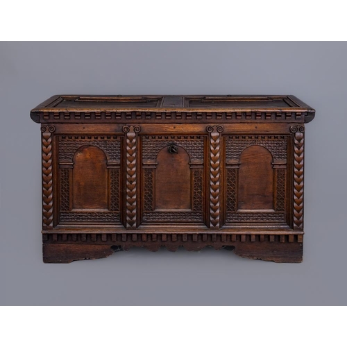 672 - A NORTH EUROPEAN OAK BOARDED CHEST, probably German 18th century, the hinged lid with two moulded ed... 