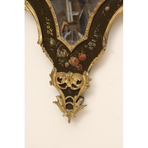 673 - A PAINTED AND GILT METAL MOUNTED WALL MIRROR, 20th century, of shield form in the French rococo styl... 