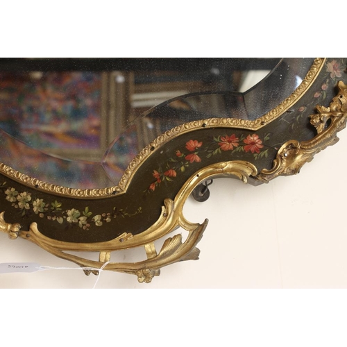 673 - A PAINTED AND GILT METAL MOUNTED WALL MIRROR, 20th century, of shield form in the French rococo styl... 