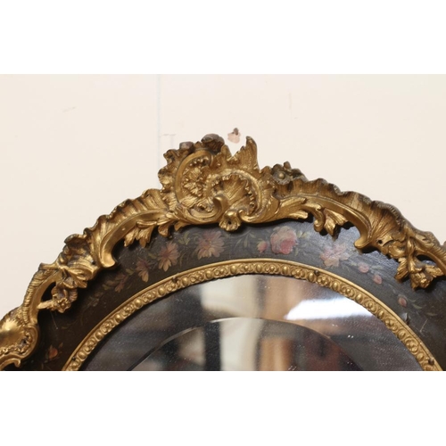 673 - A PAINTED AND GILT METAL MOUNTED WALL MIRROR, 20th century, of shield form in the French rococo styl... 