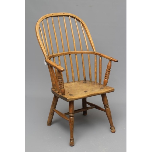 675 - AN ASH STICK BACK WINDSOR ARMCHAIR, early/mid 19th century, with hoop back, ring turned baluster arm... 