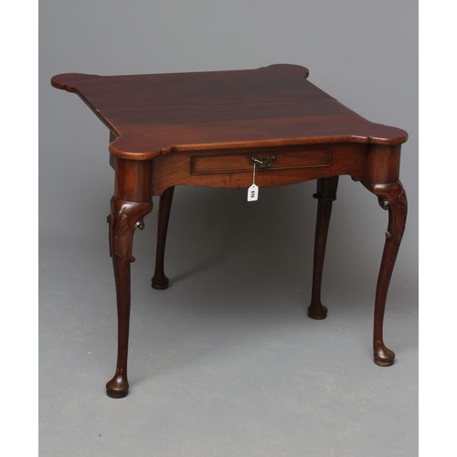 679 - A GEORGE II DESIGN MAHOGANY FOLDING TEA TABLE, late 19th century, the eared oblong top over waved fr... 