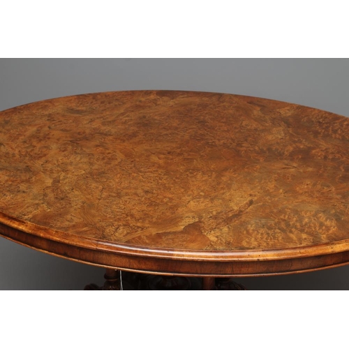 695 - A VICTORIAN WALNUT LOO TABLE, third quarter 19th century, the oval burr quarter veneered tilt top wi... 