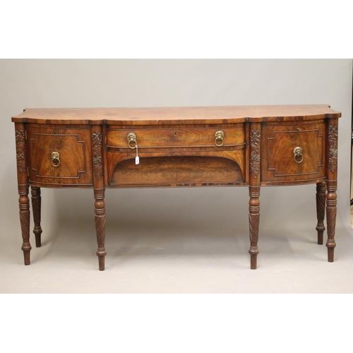 707 - A REGENCY MAHOGANY BOWED SIDEBOARD, early 19th century, the eared top with central shallow drawer ov... 