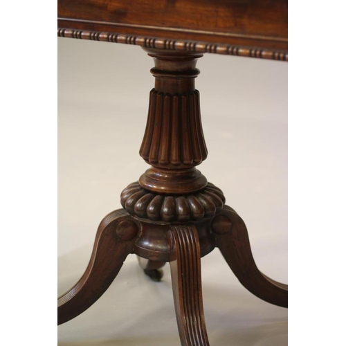 711 - A GILLOWS REGENCY MAHOGANY FOLDING CARD TABLE, early 19th century, the rounded oblong bead and reel ... 