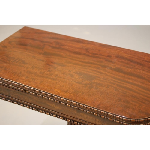 711 - A GILLOWS REGENCY MAHOGANY FOLDING CARD TABLE, early 19th century, the rounded oblong bead and reel ... 