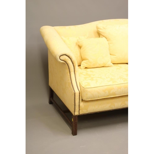 724 - A GEORGIAN STYLE HUMP BACKED SOFA, 20th century, upholstered in yellow floral silk damask, scrolled ... 