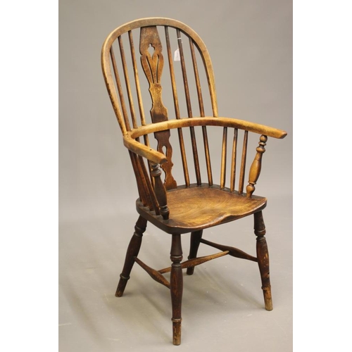 730 - AN ASH AND ELM WINDSOR ARMCHAIR, second half 19th century, the high hoop back with fleur de lys spla... 