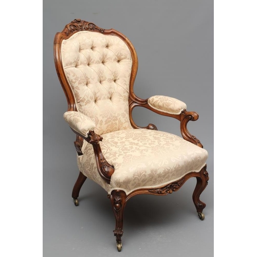 731 - A VICTORIAN WALNUT SHOW FRAME SALON CHAIR, late 19th century, of spoon back form button upholstered ... 