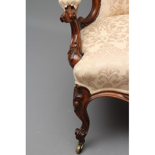 731 - A VICTORIAN WALNUT SHOW FRAME SALON CHAIR, late 19th century, of spoon back form button upholstered ... 