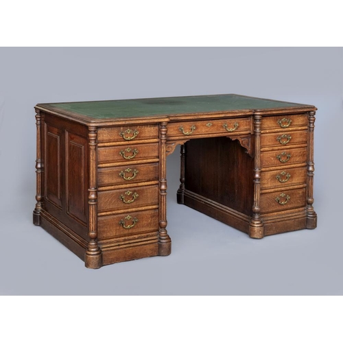 733 - A VICTORIAN OAK PARTNERS' DESK, late 19th century, of inverted breakfront form lined in tooled green... 