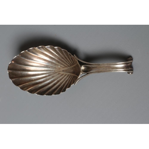 102 - A WILLIAM IV SILVER CADDY SPOON, maker's mark WF, London 1831, the leaf shaped bowl with scroll hand... 