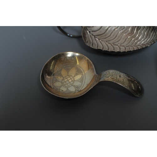 103 - A GEORGE III SILVER LEAF CADDY SPOON by Edward Mayfield or Elizabeth Morley, London 1807, with plain... 