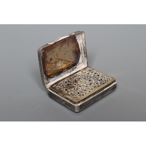 107 - A WILLIAM IV SILVER VINAIGRETTE by Nathanial Mills, Birmingham 1832, of plain oblong form with wavy ... 