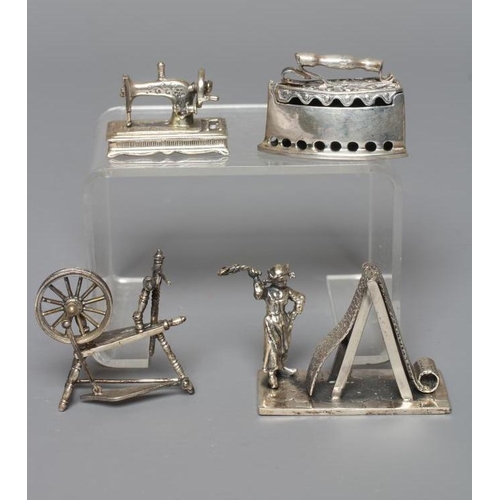 110 - A MODERN SILVER MINIATURE FIGURE, maker's mark SMC, London import mark, cast as a Dutch woman beatin... 