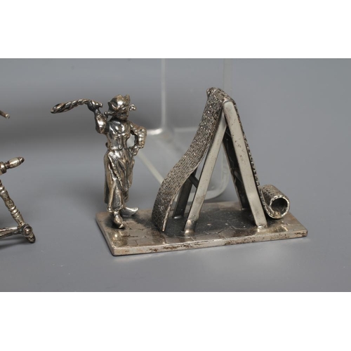 110 - A MODERN SILVER MINIATURE FIGURE, maker's mark SMC, London import mark, cast as a Dutch woman beatin... 