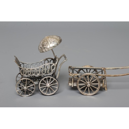 111 - FOUR MINIATURE SILVER MODELS all stamped 925, comprising a perambulator with parasol, 2 1/2