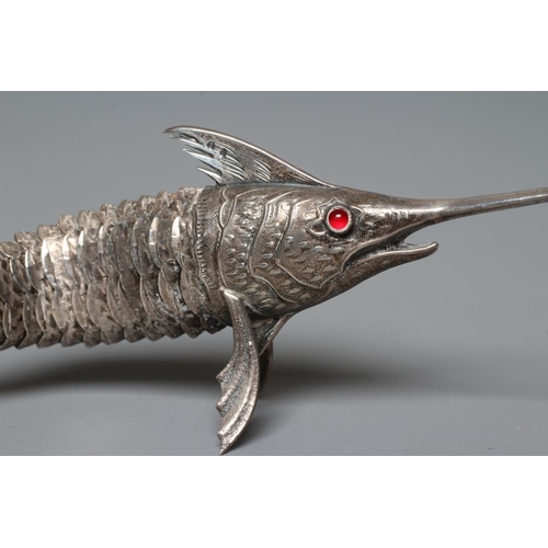 113 - A SPANISH SILVER ARTICULATED SWORDFISH with chased detailing and collet set ruby glass cabochon eyes... 