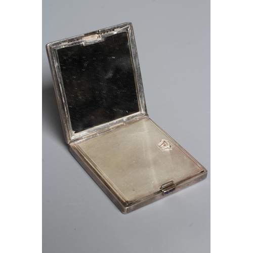 116 - AN ART DECO SILVER COMPACT imported by Stockwell & Co., London 1935, of square form with engine turn... 