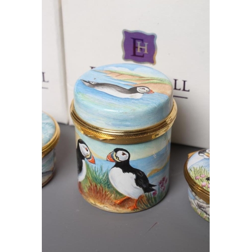 127 - THREE ELLIOT HALL ENAMEL BOXES comprising a cylindrical box painted by Marie Graves with Puffins, 2