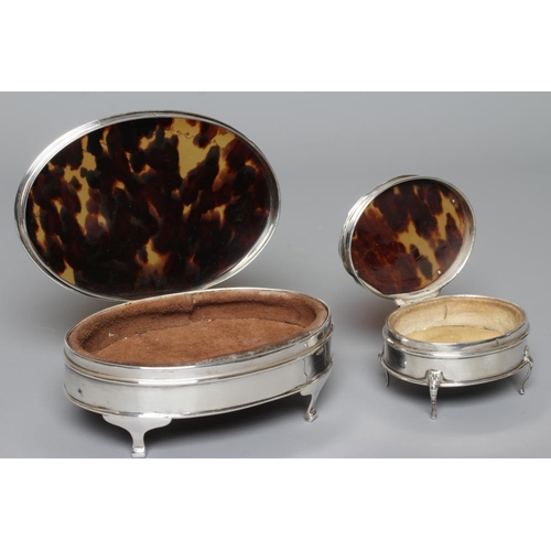 135 - A SILVER OVAL DRESSING TABLE BOX by Adie Bros., Birmingham 1924, the hinged cover with pique work to... 