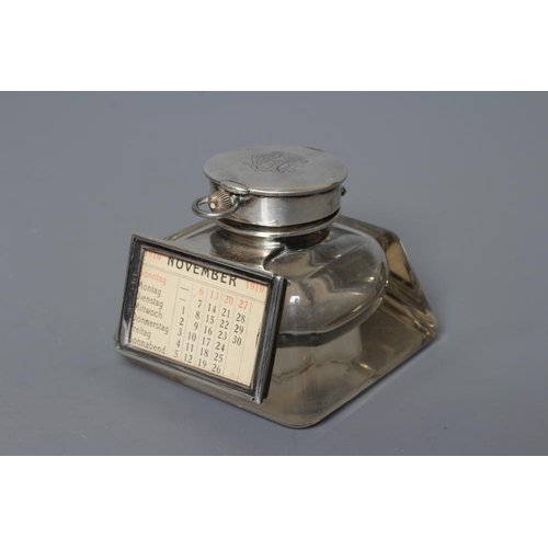 137 - AN EDWARDIAN SILVER MOUNTED COMBINATION INKWELL/PERPETUAL CALENDAR AND WATCH HOLDER by John Grinsell... 