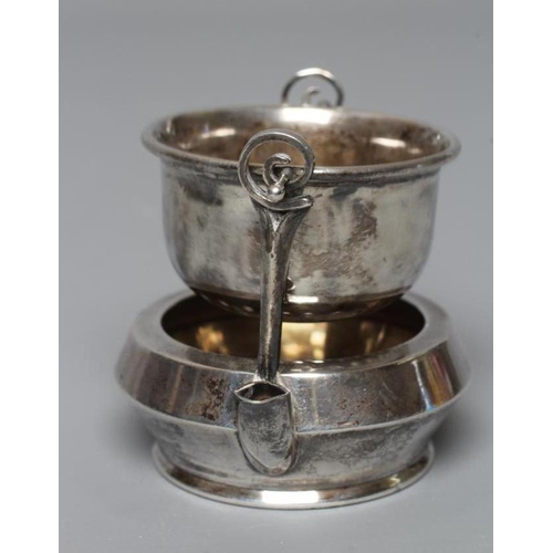 140 - A SILVER TEA STRAINER ON STAND by Adie Brothers Ltd., Birmingham 1923, the plain pierced U strainer ... 