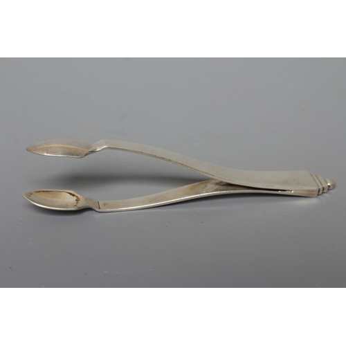 143 - A PAIR OF GEORG JENSEN SILVER PYRAMID PATTERN SUGAR TONGS imported by Stockwell & Co., London 1929, ... 