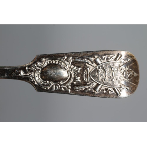 153 - AN EDWARDIAN SILVER FIDDLE PATTERN TABLESPOON by Charles T Maine, London 1908, the finial cast in re... 