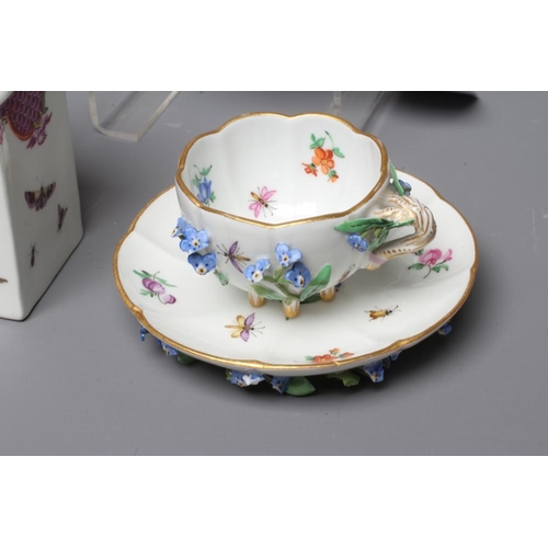 16 - A COLLECTION OF CONTINENTAL PORCELAIN comprising a flower encrusted Meissen cabinet cup and saucer o... 