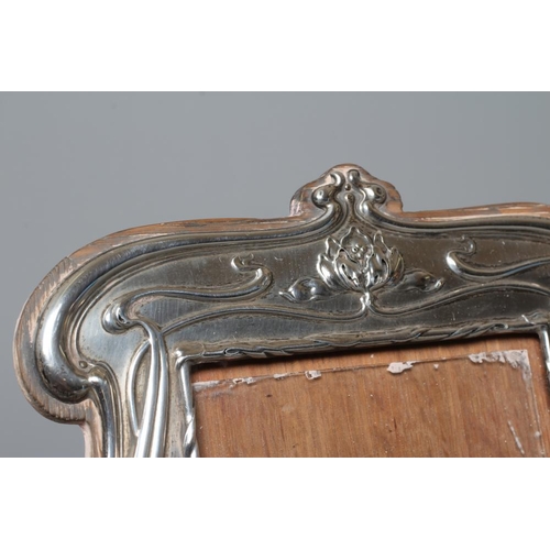 180 - AN EDWARDIAN SECESSIONIST STRUT BACK SILVER PHOTOGRAPH FRAME by Lawrence Emanuel, Birmingham 1908, o... 