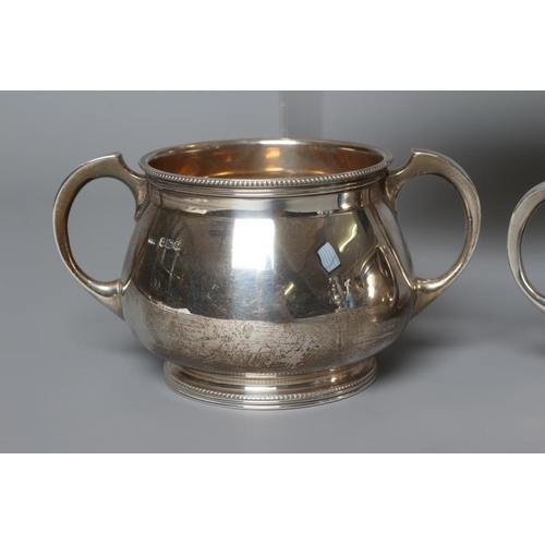 199 - A COMPOSITE THREE PIECE SILVER TEA SERVICE by Mappin & Webb, Sheffield 1923 (sugar) and 1925, of pla... 