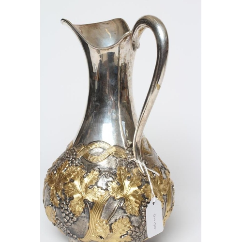 201 - A SILVER WINE EWER, stamped 900 YM(?), of baluster form with S scroll hollow handle, the partial par... 