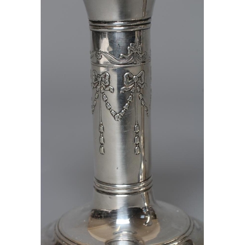 208 - A PAIR OF EDWARDIAN SILVER SMALL CANDLESTICKS by Robert Pringle & Sons, Chester 1907, the fixed swep... 