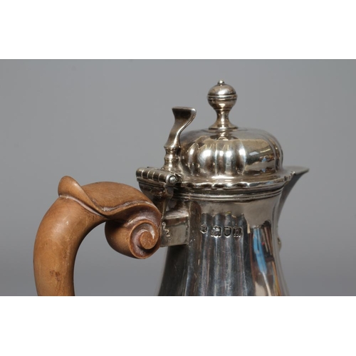 214 - AN EDWARDIAN SILVER HOT MILK JUG by Lambert & Co., London 1903, of lobed baluster form, the hinged d... 