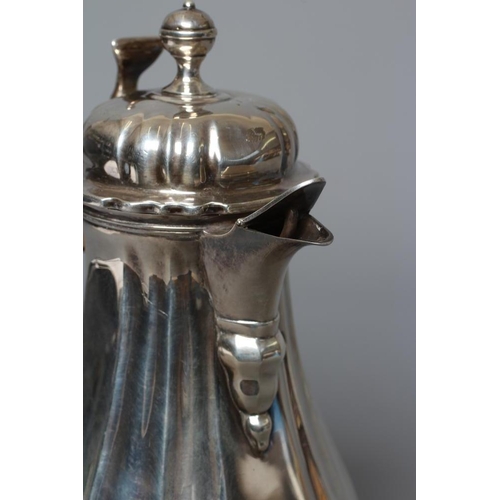 214 - AN EDWARDIAN SILVER HOT MILK JUG by Lambert & Co., London 1903, of lobed baluster form, the hinged d... 